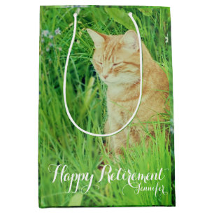 Retirement sleeping ginger cat in a meadow medium gift bag