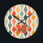 Retro Groovy Pattern Round Clock<br><div class="desc">Your monogram and first name highlight a retro mod circle pattern in a groovy colour palette,  this wall clock is fun for you,  your kids,  and college dorm rooms or give as a gift. (You can remove the monogram and first name,  just leave the personalisation blank.)</div>