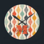 Retro Groovy Pattern Round Clock<br><div class="desc">Your monogram and first name highlight a retro mod circle pattern in a groovy colour palette,  this wall clock is fun for you,  your kids,  and college dorm rooms or give as a gift. (You can remove the monogram and first name,  just leave the personalisation blank.)</div>