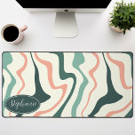 Retro Modern Abstract Marble Swirl Pink And Mint Desk Mat<br><div class="desc">Immerse yourself in a dance of colours with our Abstract Retro Modern Liquid Marble Wave Pattern. Evoking the dynamic fluidity of marbled surfaces and the charming aesthetics of retro-modern design, this pattern is a feast for the eyes. A symphony of vibrant colours swirls and flows in wave-like motions, creating a...</div>