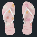Retro Pink Daisy Flip Flops for Bridesmaids<br><div class="desc">Step into retro summer in style with these personalised Ditzy Daisy flip flops! The light pink flip flops feature a playful and nostalgic daisy pattern, perfect for adding a touch of fun to any bachelorette or wedding celebration. The white straps are comfortable and durable, making them ideal for a day...</div>