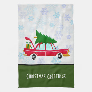 Retro Red Car Carrying a Christmas Tree Tea Towel