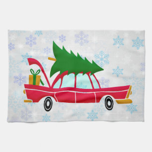Retro Red Car Carrying a Christmas Tree Tea Towel