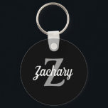 Retro Script Black Grey White Monogram Key Ring<br><div class="desc">This personalised keychain features a light grey monogram initial and white retro script name on a black background. A simple yet distinctive design for  a man or woman.</div>
