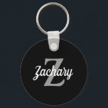 Retro Script Black Grey White Monogram Key Ring<br><div class="desc">This personalised keychain features a light grey monogram initial and white retro script name on a black background. A simple yet distinctive design for  a man or woman.</div>