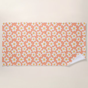Retro style daisies in bloom on orange background beach towel