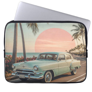 Retro-style vintage car on a coastal road laptop sleeve