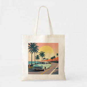 Retro-style vintage car on a coastal road tote bag