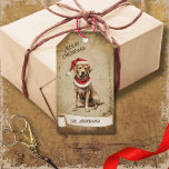 Retro Vintage Dog with Red Christmas Hat Gift Tags<br><div class="desc">Beautiful retro vintage illustration of a dog wearing a red Christmas hat on a retro grunge background and frame for an aged or vintage look. Design features a vintage scroll ribbon for your personalisation both in the front or the back sides of this elegant,  and timeless Holiday Gift Tag.</div>