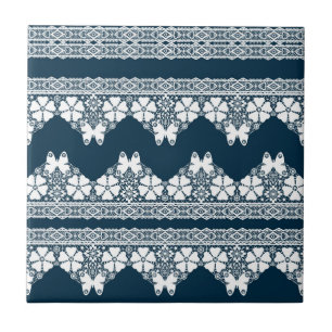 Retro white lace with butterflies on a dark blue b tile
