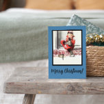 Retro Winter Baby Boy Steps Blue Framed Christmas Holiday Postcard<br><div class="desc">This Vintage Themed Retro Christmas Winter Black Title,  Blue Background and White Snow Holiday Postcard with Baby Boy seating outside on steps in red overalls with Chrismas greeting "Merry Christmas" will be perfect for your holiday greetings. You can also find other designs in this style in my Zazzle store.</div>