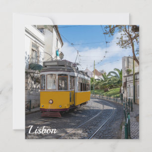 Retro yellow tram on street in Lisbon Portugal