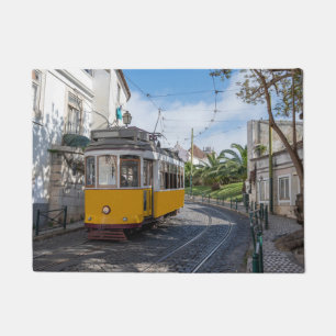 Retro yellow tram on street in Lisbon, Portugal Doormat