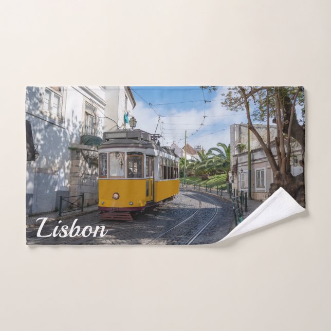 Retro yellow tram on street in Lisbon Portugal Hand Towel (Hand Towel)