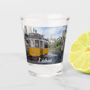 Retro yellow tram on street in Lisbon, Portugal Shot Glass