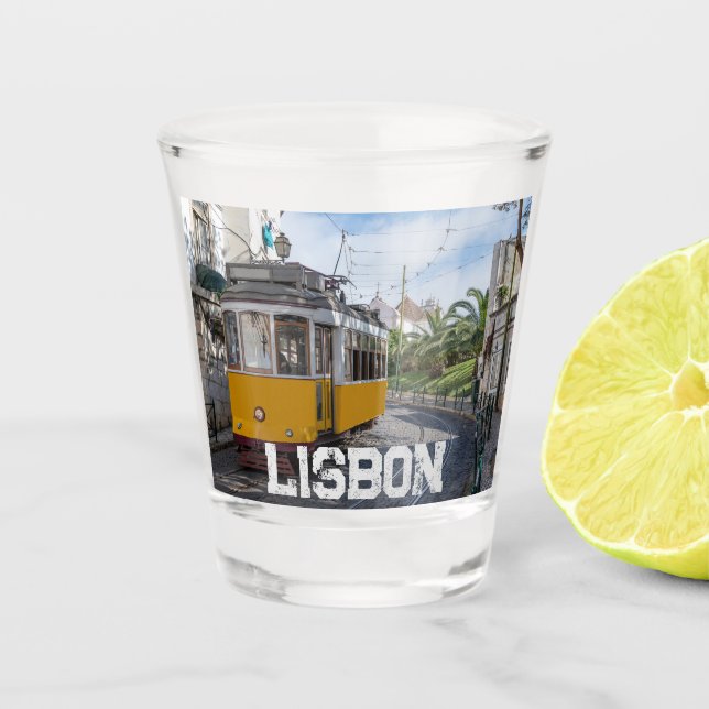 Retro yellow tram on street in Lisbon, Portugal Shot Glass (Front)