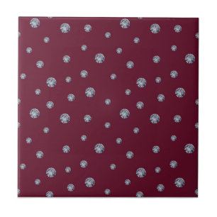 Rhinestones on dark red tile