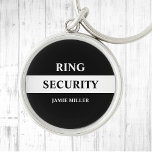 Ring Security Ring Bearer  Key Ring<br><div class="desc">Make your ring bearer feel like a secret agent with this stylish black and white "Ring Security" keychain. The design features a sleek, agent style design that is sure to impress. Perfect for weddings, this button adds a fun and unique touch to your special day. With its trendy and stylish...</div>