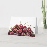ripe red cherry pile on white