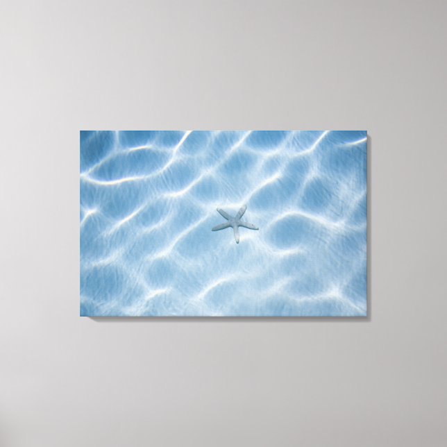 Rippled blue water with starfish canvas print (Front)