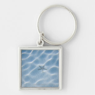 Rippled blue water with starfish key ring