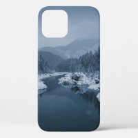 RIVER SURROUNDED BY SNOW COVERED FIELD WITH PINE T