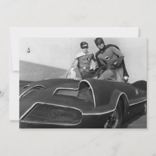 Robin and Batman Standing in Batmobile
