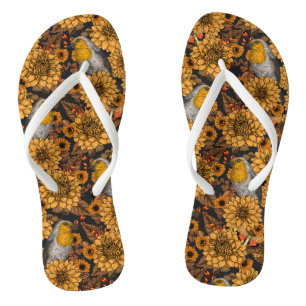 Robins in the autumn garden on black flip flops