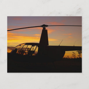 Robinson R44 helicopter at sunset Postcard