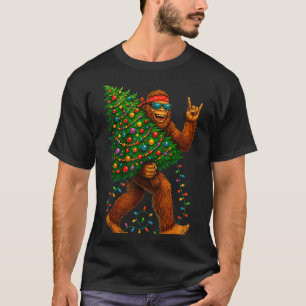Rockin Christmas Bigfoot Carrying Tree Fun Xmas Ro T-Shirt