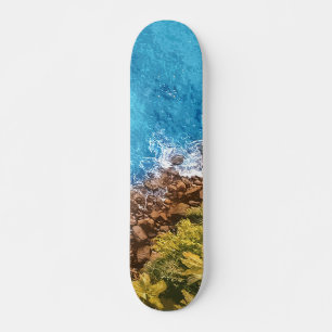 Rocks in the sea, above view 1 skateboard