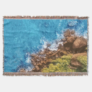 Rocks in the sea, above view 1 throw blanket