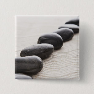 Rocks on sand 15 cm square badge