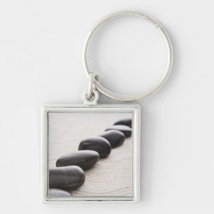 Rocks on sand key ring