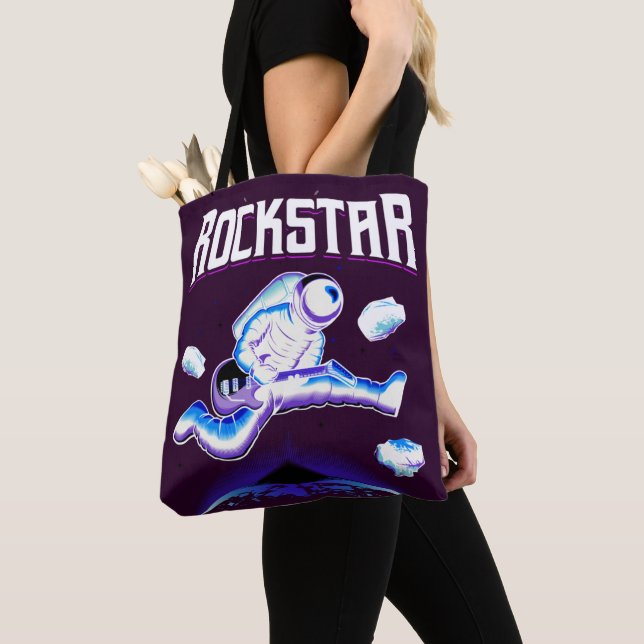 Rockstar astronaut playing guitar in space  tote bag (Close Up)