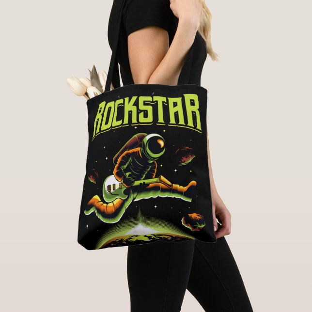 Rockstar astronaut playing guitar in space tote bag (Close Up)