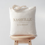 Roman Numeral Date & City Wedding Welcome Tote Bag<br><div class="desc">These modern minimalist wedding tote bags make great bridal party gifts,  welcome bags,  or favours. Clean minimal design features your wedding city and date in modern tan khaki serif lettering,  bisected by a single line. Your wedding date in roman numerals adds a chic touch.</div>