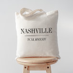 Roman Numeral Date & City Wedding Welcome Tote Bag<br><div class="desc">These modern minimalist wedding tote bags make great bridal party gifts,  welcome bags,  or favours. Clean minimal design features your wedding city and date in modern black serif lettering,  bisected by a single line. Your wedding date in roman numerals adds a chic touch.</div>