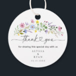 Romantic Boho Garden Wildflower Thank You Favour Tags<br><div class="desc">Add a heartfelt finishing touch to your wedding favours with these watercolor wildflower thank you tags. Featuring a spray of hand-painted blooms in pink, purple, yellow, and blue with elegant script that reads “thank you, ” this round tag is personalised with your names and wedding date. Perfect for attaching to...</div>