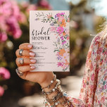 Romantic boho pink wildflower garden bridal shower invitation<br><div class="desc">Celebrate her love story with this soft and romantic spring bridal shower invitation, featuring a delicate blush background and hand-painted pastel wildflowers in peach, pink, and lilac tones. The elegant script pairs beautifully with the watercolor floral bouquet, making it perfect for a garden tea party, brunch and bubbly, love is...</div>