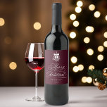 Romantic Calligraphy Merry Christmas Burgundy Wine Label<br><div class="desc">This Christmas wine label features elegant and romantic swirly calligraphy lettering,  accented with a winter berry holly bouquet . For more advanced customisation of this design,  please click the BLUE DESIGN TOOL BUTTON. Matching items are also available.</div>