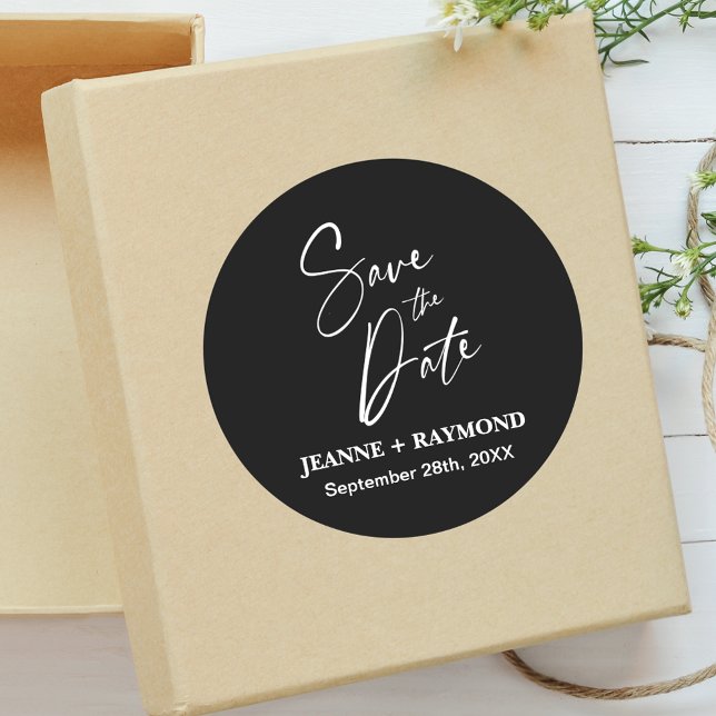 Romantic Calligraphy Wedding Save the Date Black Classic Round Sticker (Romantic black calligraphy sticker adds elegant style to wedding save the date invitations.)