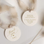 Romantic Gold and Ivory Cream Wedding Thank You Favour Tags<br><div class="desc">Elevate your wedding favours with our Round Romantic Gold and Ivory Wedding Favour Tags. These exquisite tags feature a delicate romantic script that conveys a heartfelt "thank you, " along with the loving initials of the couple, creating a personalised touch. In a harmonious blend of soft cream and shimmering gold,...</div>