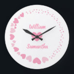 Romantic Heart custom Couple Name Love white  Large Clock<br><div class="desc">Celebrate love every second with this elegant personalised wall clock featuring a romantic design of pink hearts on a black background. The centre showcases two custom names above and below a heart motif, making it perfect for couples, anniversaries, weddings, or Valentine's Day. A thoughtful gift and a stylish addition to...</div>