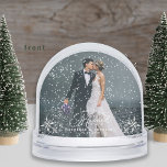 Romantic Wedding Photo First Christmas Snow Globe<br><div class="desc">Celebrate your first Christmas as a married couple with this enchanting snow globe. Featuring your cherished wedding photo, this unique keepsake captures the magic of your special day. The elegant design, featuring delicate snowflakes and a romantic script, adds a touch of winter wonder to your holiday memories. Personalise it with...</div>
