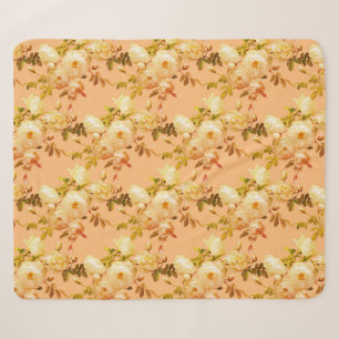 Romantic white roses on orange sherpa blanket