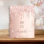 Rose gold blush glitter drips monogram name 2025 planner<br><div class="desc">A rose gold background with elegant blush faux glitter drips, paint dripping look. Personalise and add a year (upside down) and add a name. The name is written in dark rose gold with a large modern hand lettered style script with swashes. Perfect for school, work or organising your personal/family life....</div>