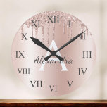 Rose Gold - Blush Pink Glitter Metal Monogram Name Round Clock<br><div class="desc">Rose Gold - Blush Pink Faux Foil Metallic Sparkle Glitter Brushed Metal Monogram Name and Initial Luxury Wall Clock. This makes the perfect sweet 16 birthday,  wedding,  bridal shower,  anniversary,  baby shower or bachelorette party gift for someone that loves glam luxury and chic styles.</div>