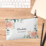 Rose gold florals bridesmaid accessory pouch<br><div class="desc">A white background.  Decorated with watercolored rose gold roses,  eucalyptus greenery and golden sprigs. 
Personalise and add the name of your bridesmaid.</div>