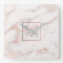 rose gold monogram on pink marble stone